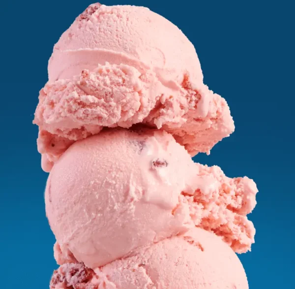 3 scoops of strawberry ice cream on a blue background